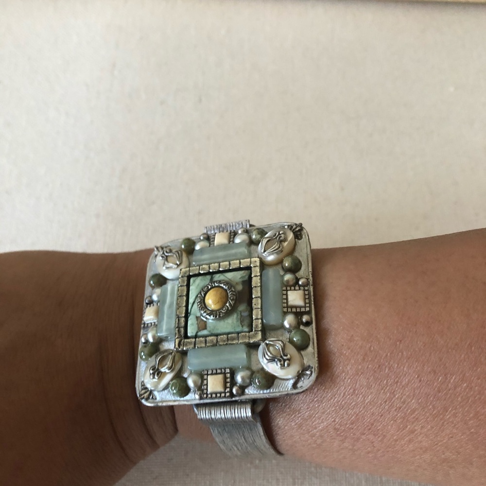 Silver tone cuff bracelet with stones
